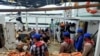 Petugas gabungan saat melakukan pemeriksaan di kapal penangkap ikan China, Lu Huang Yuan Yu 118, di Kepulauan Riau, Rabu 8 Juli 2020. (Courtesy: Polda Kepri)