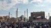 FILE - This image grab from a UGC video made available Dec. 9, 2022, reportedly shows protesters marching after Friday prayers, in Zahedan, Iran. 
