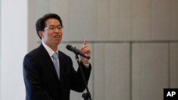 FILE - Beijing's top representative in Hong Kong, Zhang Xiaoming, in Hong Kong, July 16, 2013.