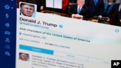 FILE - President Donald Trump's tweeter feed on a computer screen in Washington. 