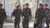Panglima militer Myanmar, Jenderal Senior Min Aung Hlaing (tengah), terlihat tiba bersama pejabat militer senior untuk mengamati latihan militer di wilayah Delta Ayeyarwaddy Myanmar, 3 Februari 2018. (Foto: AFP)
