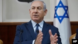 Israeli Prime Minister Benjamin Netanyahu chairs the weekly cabinet meeting at his office in Jerusalem, Jan. 7, 2018. 