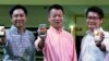 Huawei's Singapore CEO Zhou Bin (L-R), David Wei, President of Huawei South Pacific and Lim Chee Siong Chief Marketing Officer, Huawei South Pacific, show the new Huawei Ascend P6 Android-based smartphones during their launch at CommunicAsia communication
