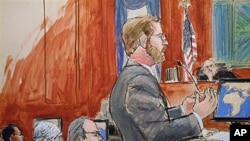 Assistant U.S. Attorney Nicholas Lewin, foreground, gives his opening statement to the jury in the trial of Ahmed Khalfan Ghailani, left, in Manhattan Federal Court in New York, 12 Oct 2010