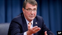 FILE - Defense Secretary Ashton Carter, shown at the Pentagon in April, says China's actions in the Asia-Pacific region are increasing demand among nations for American engagement, and "we're going to meet it."