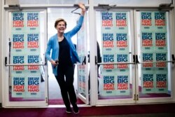 Democratic presidential candidate Sen. Elizabeth Warren, D-Mass., waves to supporters and volunteers, Feb. 29, 2020, in Columbia, S.C.