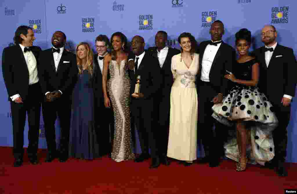 Cast and crew of "Moonlight" poses backstage with their award for Best Motion Picture - Drama at the 74th Annual Golden Globe Awards in Beverly Hills, CA Jan. 8, 2017.