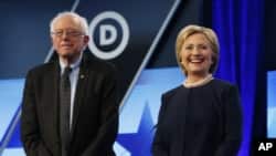 FILE - Democratic presidential candidates Hillary Clinton and Bernie Sanders stand together before the start of the Univision-Washington Post Democratic presidential debate at Miami-Dade College, March 9, 2016.
