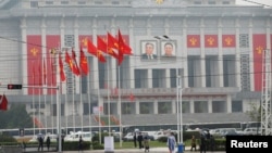 People walk near the venue of a ruling party congress in Pyongyang, North Korea, May 6, 2016. 