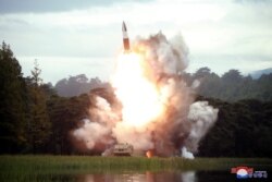 FILE - North Korea test-fires a weapon in this undated photo released Aug. 16, 2019, by the Korean Central News Agency.