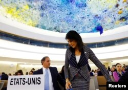 FILE - U.S. Ambassador to the United Nations Nikki Haley (R) leaves after addressing the United Nations Human Rights Council in Geneva, Switzerland, June 6, 2017. Haley said Wednesday the council has ceased "to be worthy of its name."