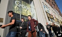 Google employees walk off the job in a protest against what they said is the tech company's mishandling of sexual misconduct allegations against executives on Nov. 1, 2018, in New York.