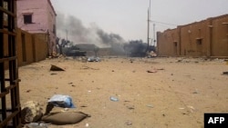Smoke billows from an army armored vehicle after an explosion in Gao, northern Mali, July 1, 2018.