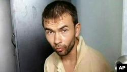 FILE - Bilal Mohammad, initially identified as Adem Karadag, is one of the two men indicted.