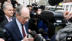 FILE - Former British Foreign Secretary Malcolm Rifkind speaks to the media in Westminster, London, Feb. 24, 2015. 