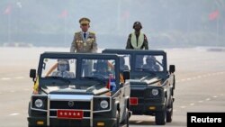 FILE - Myanmar's junta leader, Senior General Min Aung Hlaing, whose military ousted the country's elected government in a Feb. 1, 2021, coup, presides over an army parade on Armed Forces Day in Naypyitaw, Myanmar, March 27, 2021.