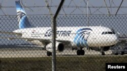 FILE - An Egyptair Airbus A320 airbus stands on the runway at Larnaca Airport in Larnaca, Cyprus.
