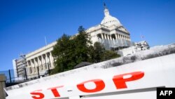 FILE - The US Capitol is seen during a government shutdown in Washington, DC, Dec. 27, 2018. 