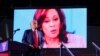 ARCHIVO - El candidato presidencial republicano y expresidente de EEUU, Donald Trump, observa mientras aparece el rostro de la candidata presidencial demócrata y vicepresidenta, Kamala Harris, durante un mitin en Huntington Place en Detroit, EEUU, el 18 de octubre de 2024