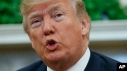 FILE - U.S. President Donald Trump in the Oval Office of the White House, March 15, 2018.
