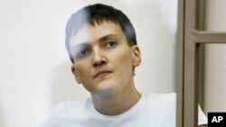 Ukrainian jailed military officer Nadezhda Savchenko sits in a glass cage during a trial in the town of Donetsk, Rostov-on-Don region, Russia on March 9, 2016. 
