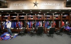 FILE - Major U.S. sports leagues are closing access to locker rooms and clubhouses to all non-essential personnel.